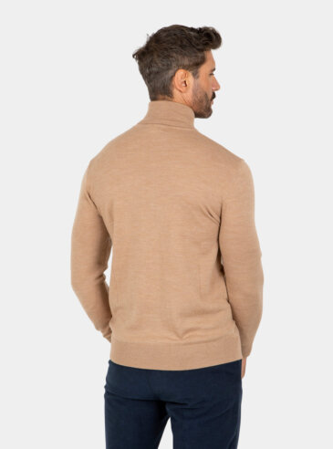 merino-wool-turtleneck-khaki-back Model wearing a khaki Merino wool turtleneck sweater, back view.