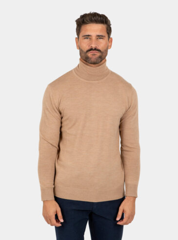 merino-wool-turtleneck-khaki-front Model wearing a khaki Merino wool turtleneck sweater, front view.