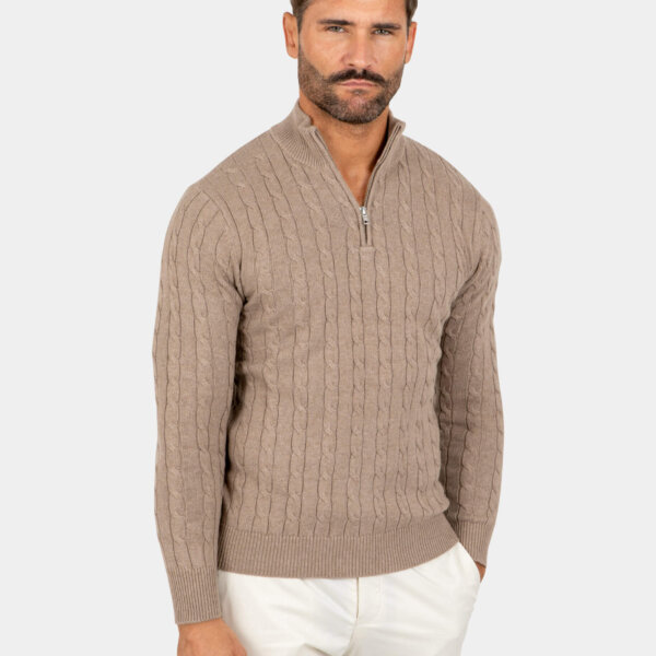 Model wearing a brown cotton cable-knit quarter zip sweater, front view.