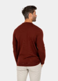 Model wearing a dark red Merino wool crew neck sweater, back view.