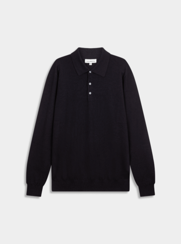 merino-wool-polo-navy-flatlay Flat-lay image of a navy Merino wool polo sweater on a white backdrop.