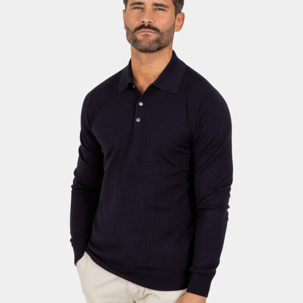 Model wearing a navy Merino wool polo sweater, front view.