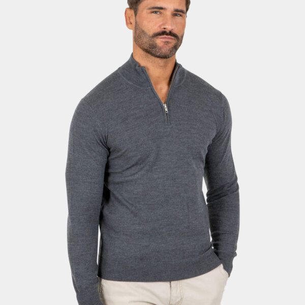 Model wearing a gray Merino wool quarter zip sweater, front view.