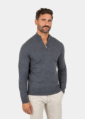 Model wearing a gray Merino wool quarter zip sweater, front view.