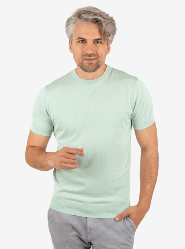 Front view of men’s green knit tee with crew neck, worn by model