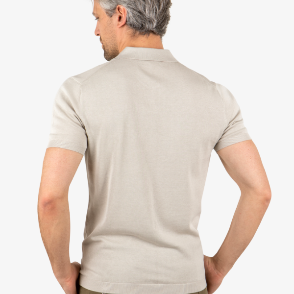 Back view of men’s open collar polo in khaki, worn by model