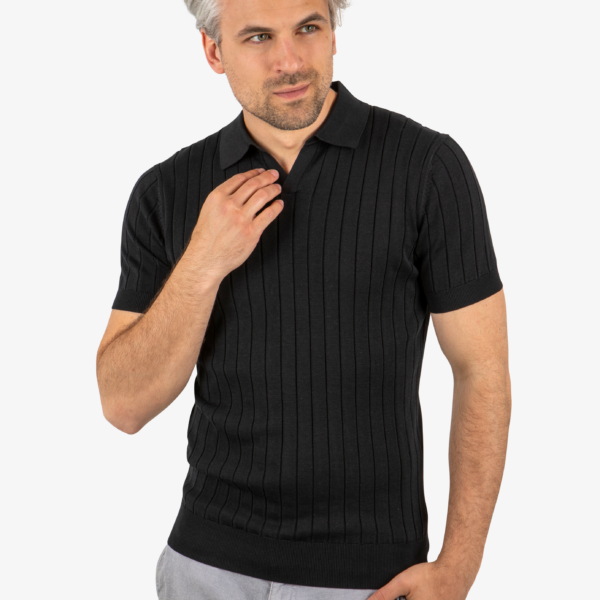 Front view of men’s ribbed knit polo in black, worn by model
