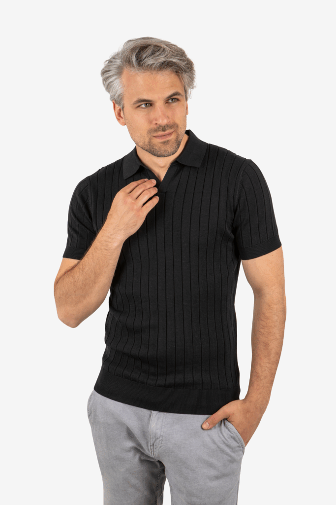 Front view of men’s ribbed knit polo in black, worn by model